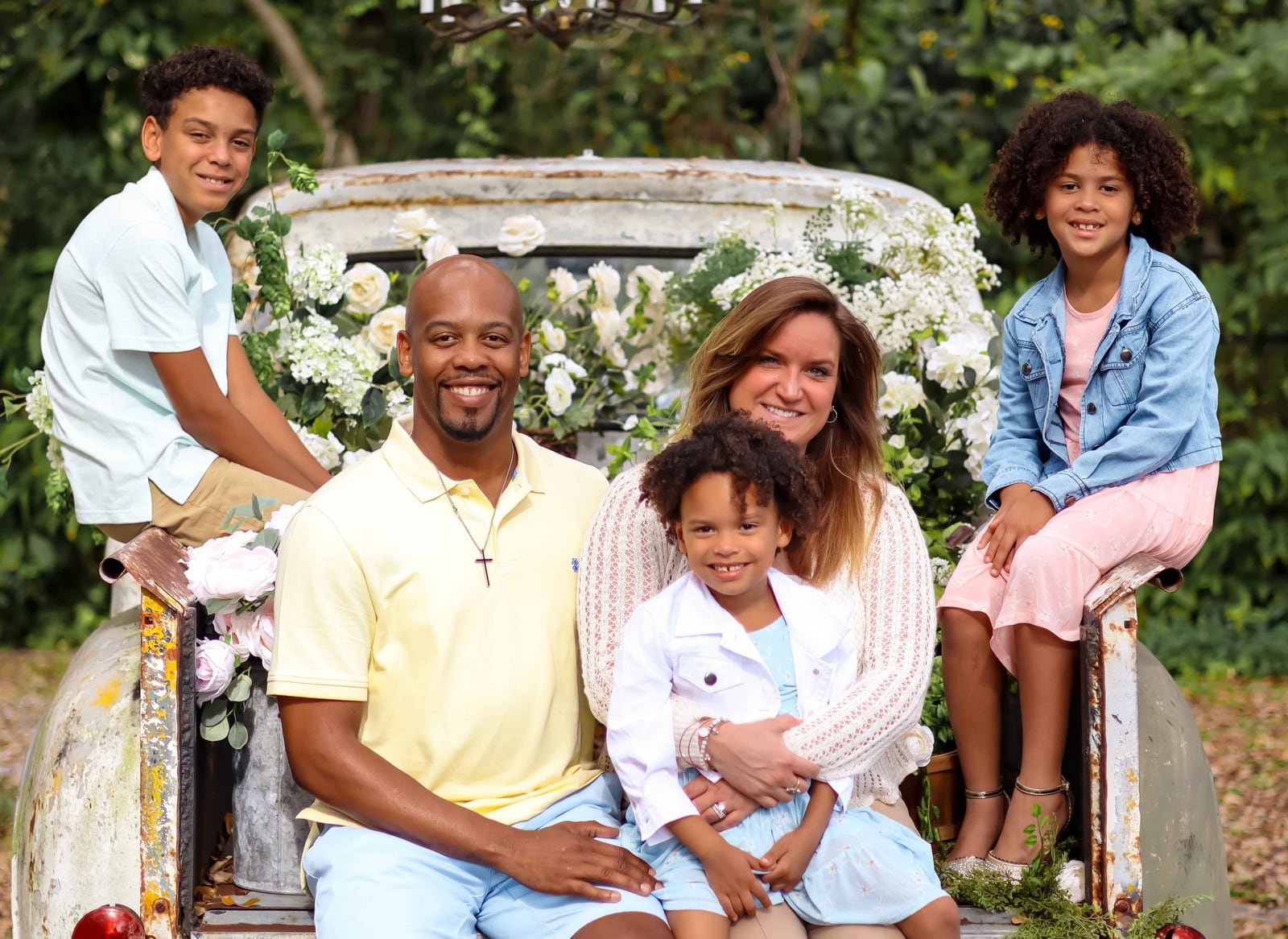 Sensei Jenkins with his wife Kate and their three children, seated outdoors