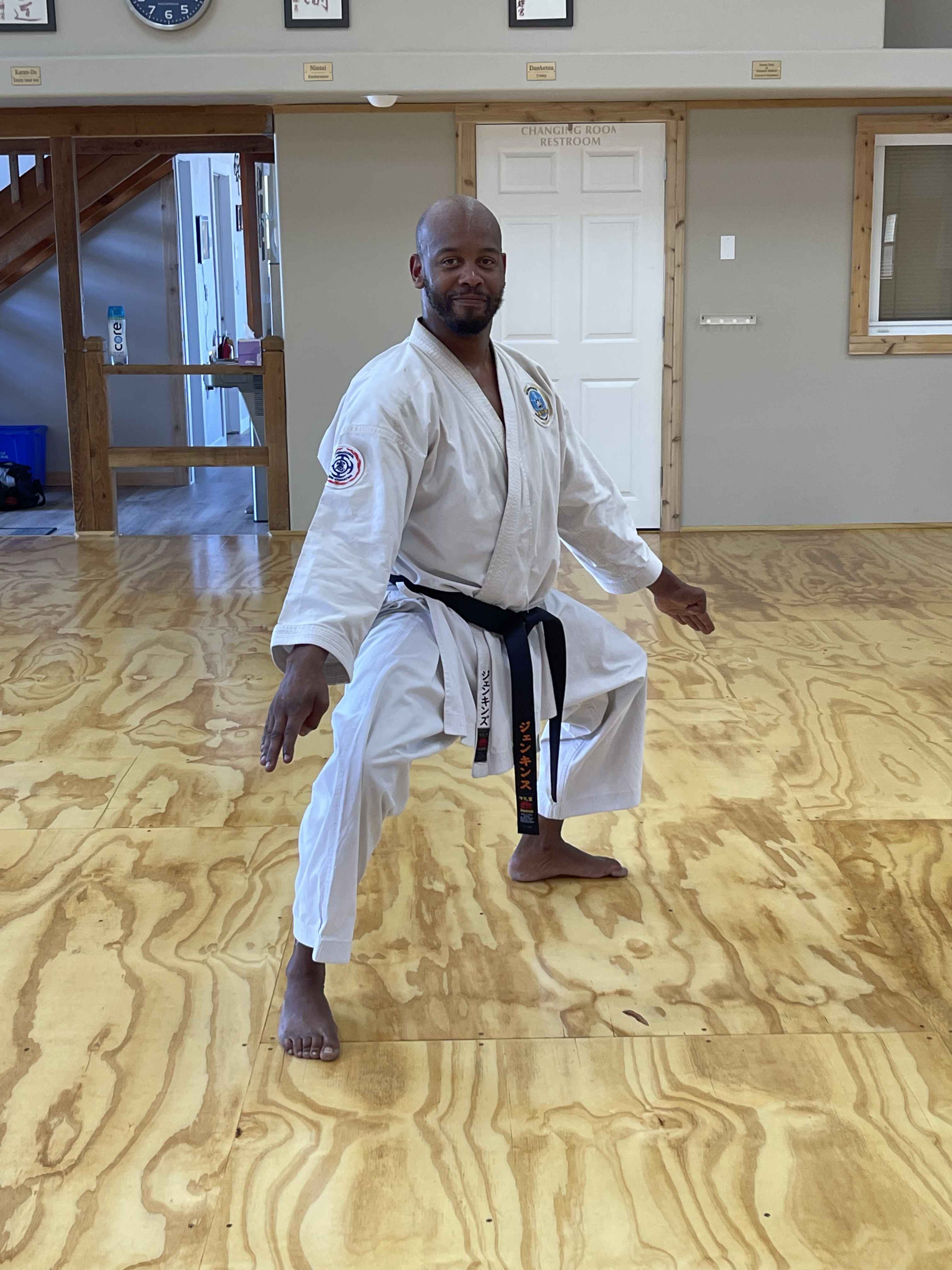 Sensei Kenneth Jenkins holding a stance on the dojo floor