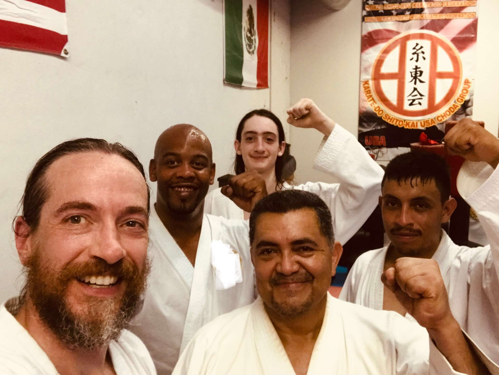 Karateka smiling together after a hard training session